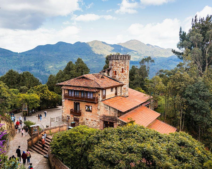 Stone buildings on Monserrate hill above Bogotá with mountain views
